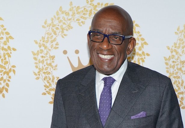 Al Roker smiling in a grey suit with purple tie against a white background