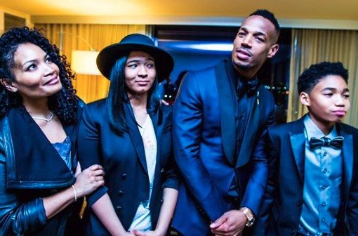 Angelica Zachary and Marlon Wayans taking a goofy photo with their two kids Shawn and Amai.