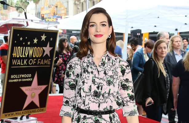 Anne Hathaway in pink and black patterned dress receives a star on the Hollywood Walk of Fame