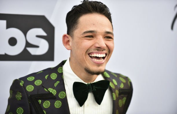 Anthony Ramos wearing a green polka-dotted suit on the red carpet