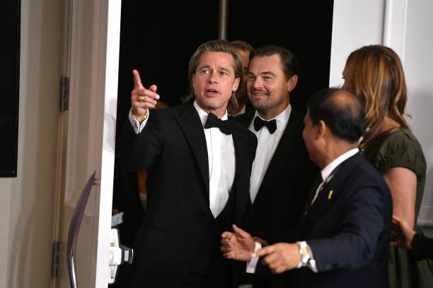 Brad Pitt and Leonardo DiCaprio pose in the press room during the 77th Annual Golden Globe Awards at