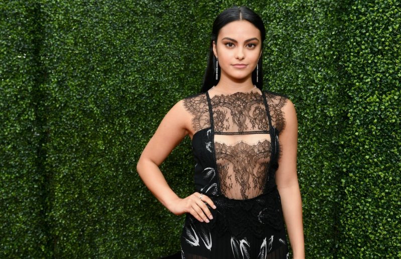 Camila Mendes in a black lace and latex dress on the red carpet