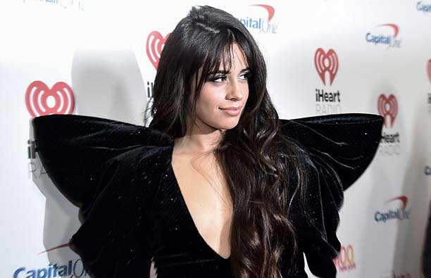 Camlla Cabello in a black dress on a red carpet