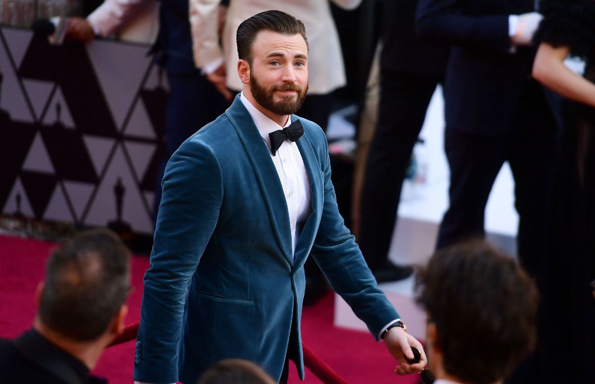 Chris Evans wearing a blue velvet tux on the red carpet