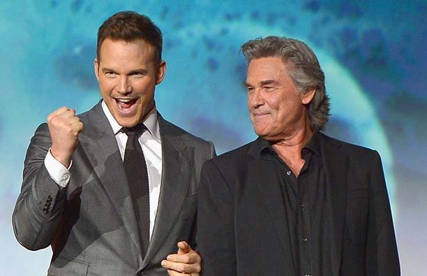 Chris Pratt pumping his fist next to a smiling Kurt Russell at a Guardians Of The Galaxy press event