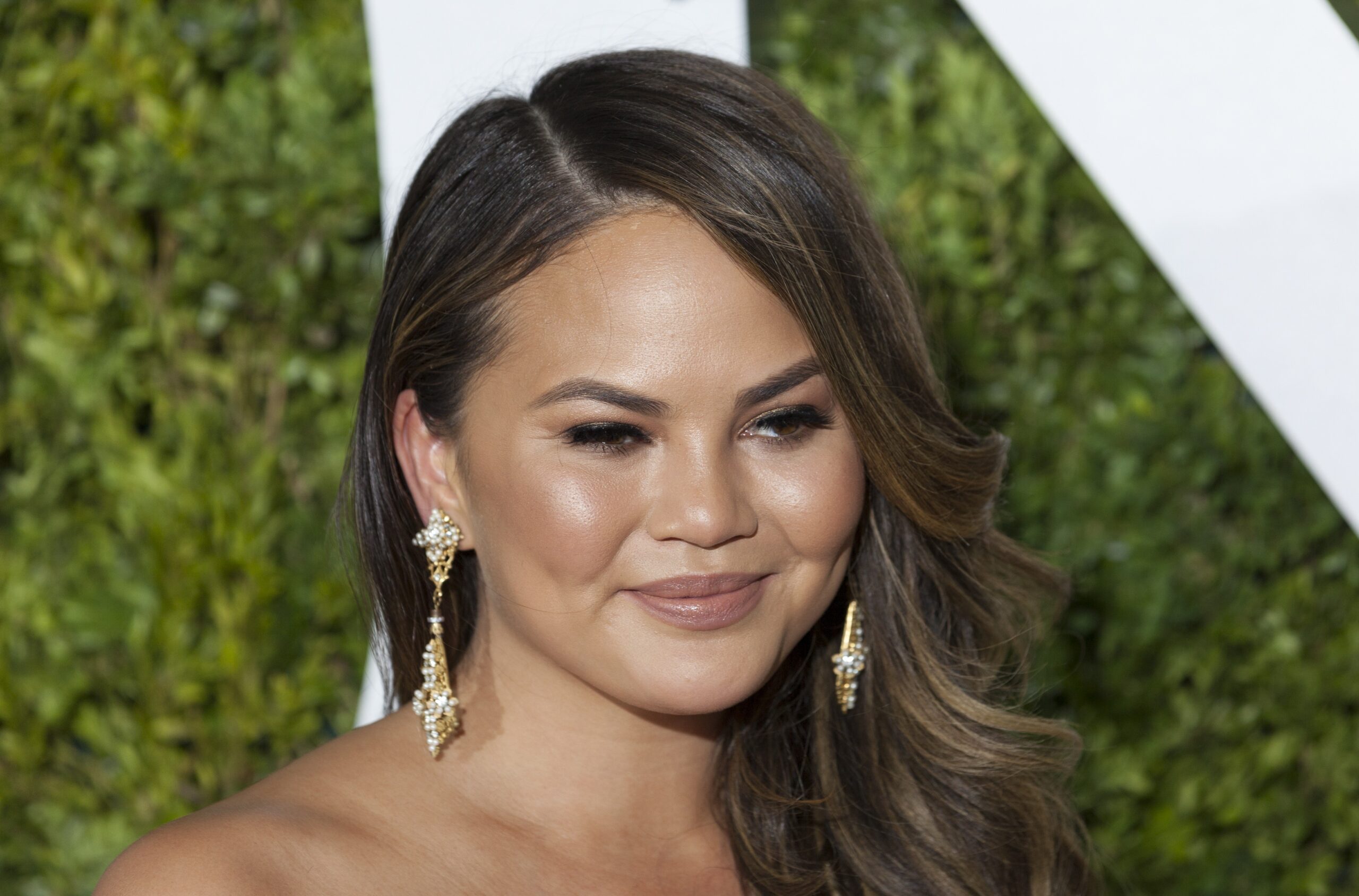 Chrissy Teigen with long wavy hair