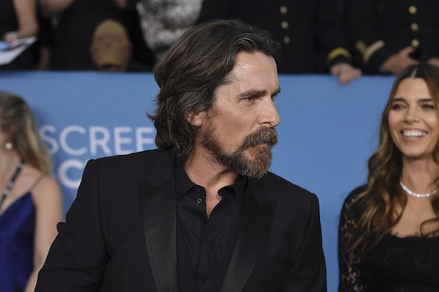 Christian Bale in a black suit and shirt at the SAG Awards
