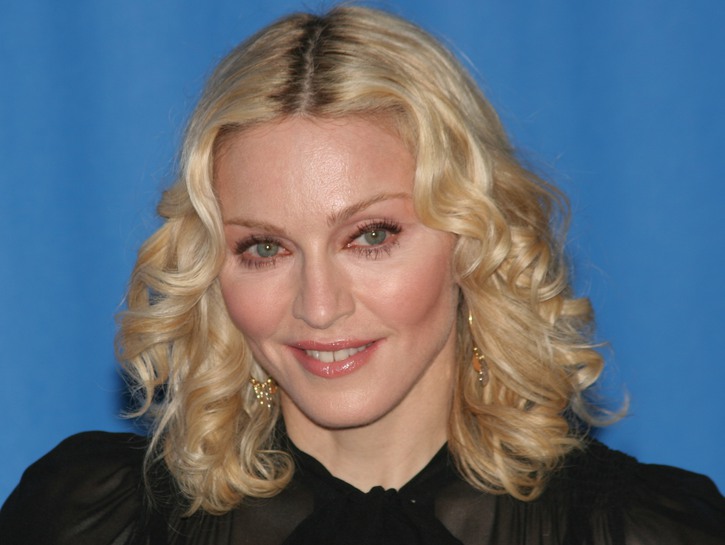 Close-up of Madonna with blonde hair in a black dress.