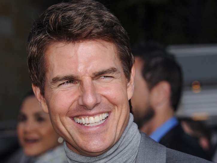 Close up of Tom Cruise smiling.