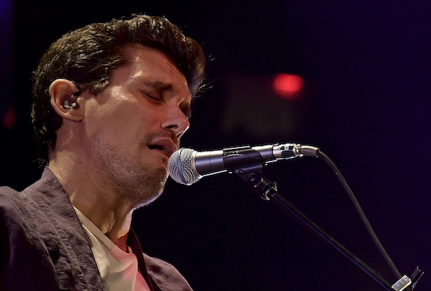close up shot of John Mayer singing into a mic at Madison Square Garden