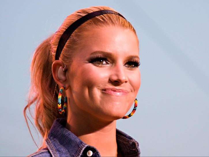 Closeup Of Jessica Simpson smiling with a pony tail.