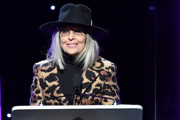 Diane Keaton at the WGA Awards in a leopard print coat with black hat and turtleneck