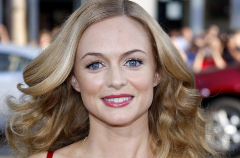 Heather Graham wears a low cut red dress to the premiere of The Hangover