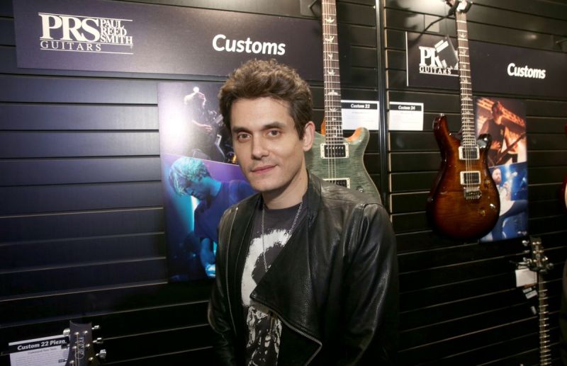John Mayer wearing a tee shirt and leather jacket at the 2017 NAMM Whow