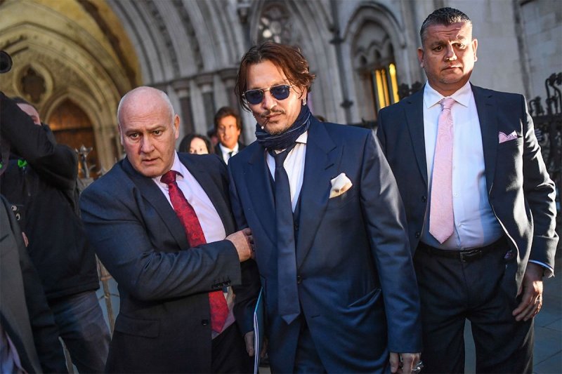 Johnny Depp leaving court in a suit
