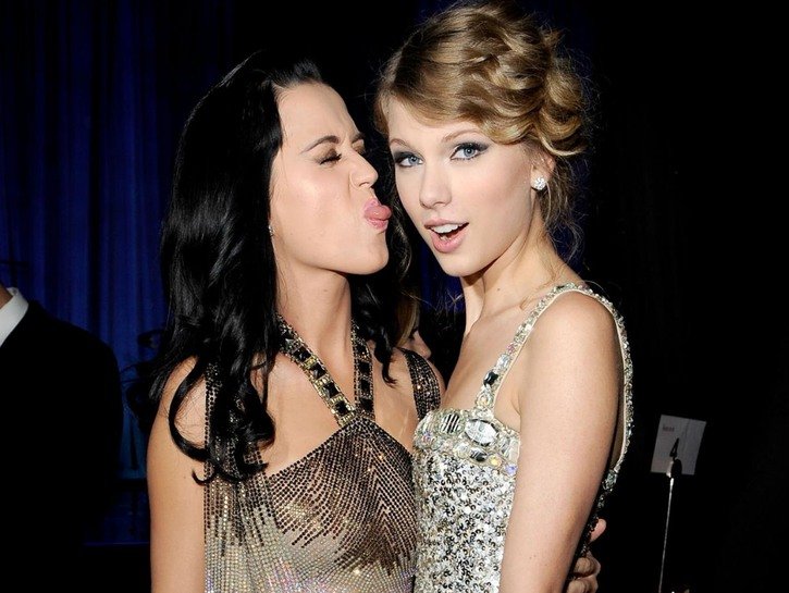 Katy Perry pulling a face at Taylor Swift as the two singers pose together during an awards sho