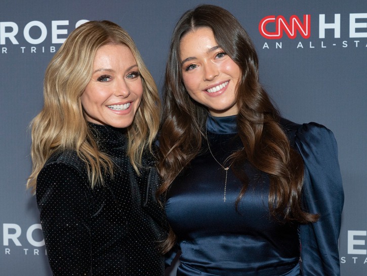 Kelly Ripa, wearing a black dress, attends the 13th Annual CNN Heroes her daughter, Lola Consuelos