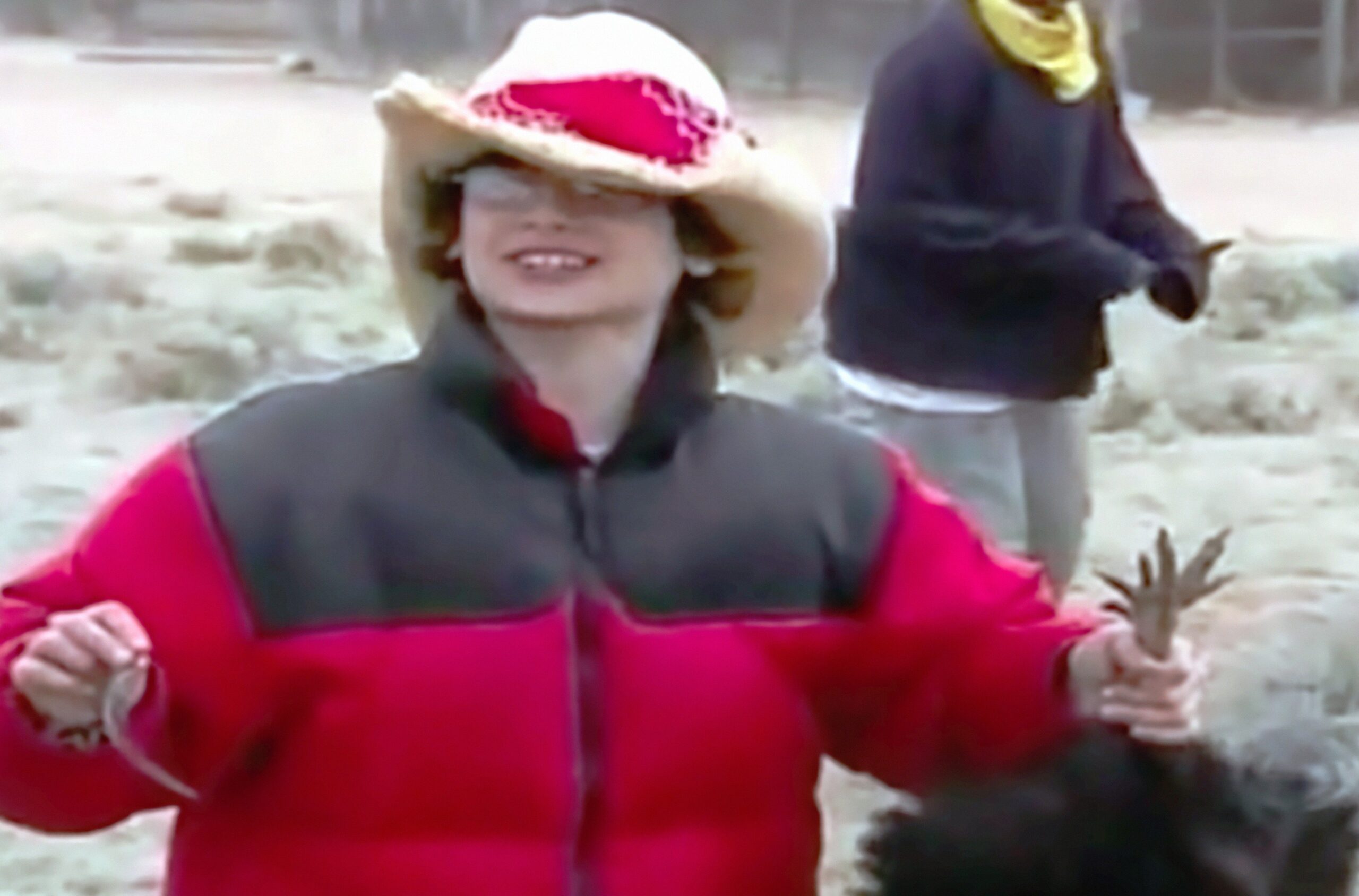 Kid on Kid Nation holding a chicken