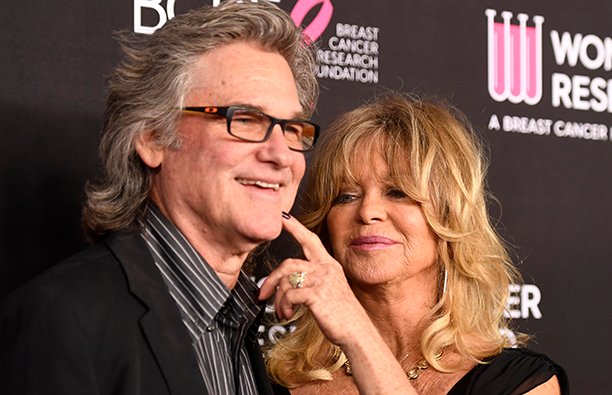 Kurt Russell and Goldie Hawn's relationship on display as she touches his cheek at a red carpet even