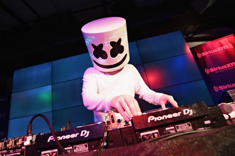 Marshmello in all white during a performance