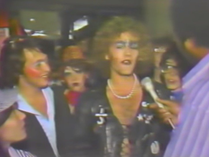 Michael Stipe dressed as Frank from the Rocky Horror Picture being interview on the local St. Louis news.