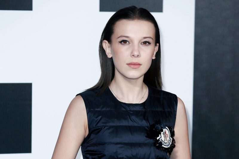 Millie Bobby Brown wearing a black dress at Milan Fashion Week