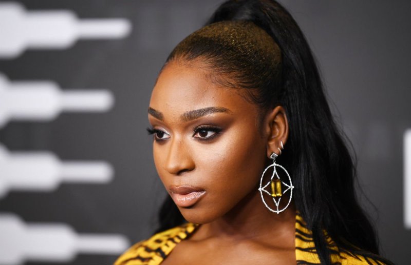 Normani in a tiger stripped outfit on the red carpet