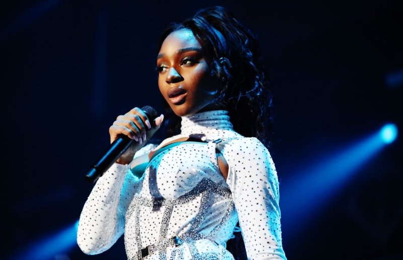 Normani in a white, sparkly ensemble onstage during 102.7 KIIS FM's 2019 Jingle Ball