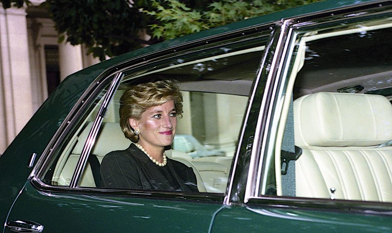 Princess Diana riding in the back of a green car in 1996.