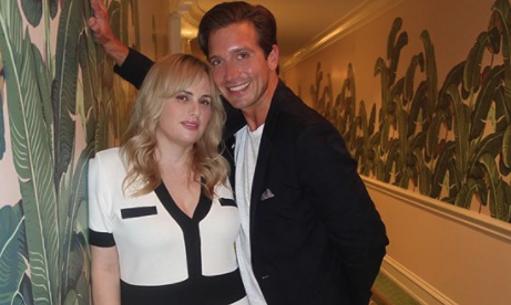 Rebel Wilson and Jacob Busch cozying up at the Beverly Hills Hotel