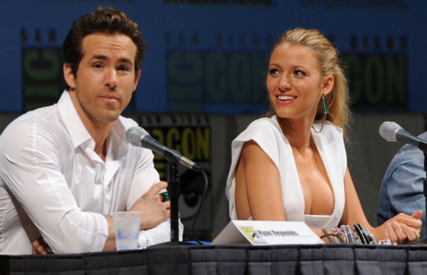 Ryan Reynolds and Blake Lively wearing white at a Comic Con panel.