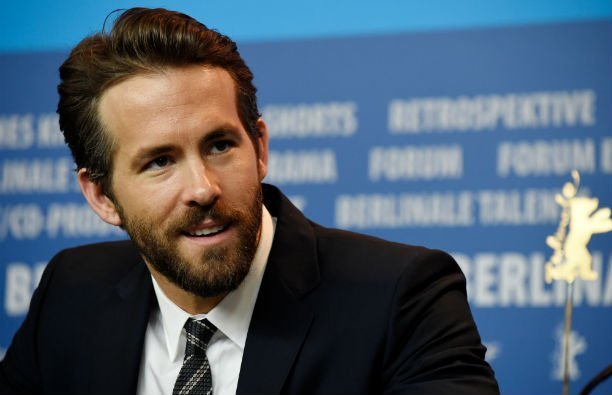 Ryan Reynolds wearing a black suit during the 'Woman in Gold' press conference