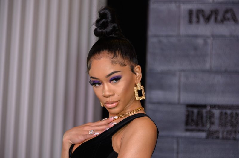 Saweetie posing on the red carpet at the premiere of 'Bad Boys For Life' in January 2020