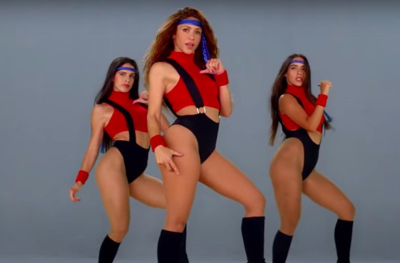 Screenshot of the Girl Like Me video featuring Shakira dancing in leg warmers and red and black