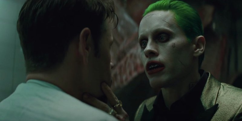 still from Suicide Squad featuring Jared Leto as Joker grabbing a man's face