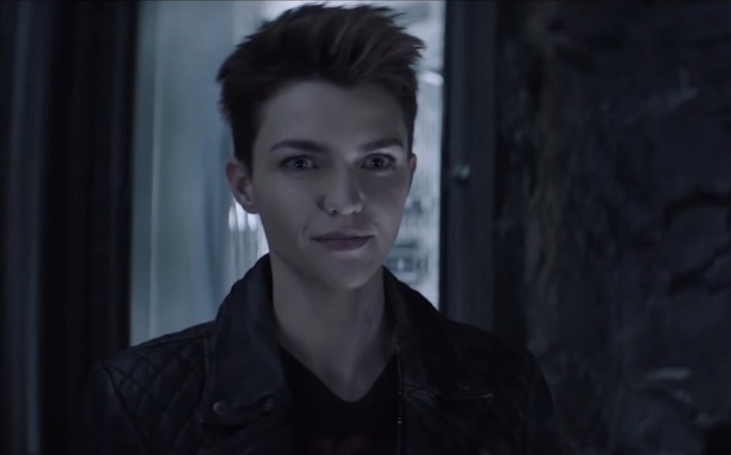 still of Ruby Rose wearing a leather jacket and smirking in Batwoman