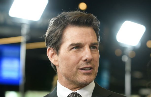 Tom Cruise wearing a dark suit at the Mission Impossible: Fallout U.S. premier.