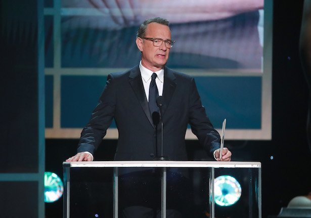 Tom Hanks in a suit presenting at the Screen Actors Guild Awards