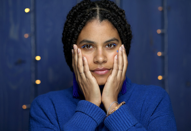 Zazie Beetz in blue against a blue background at Sundance