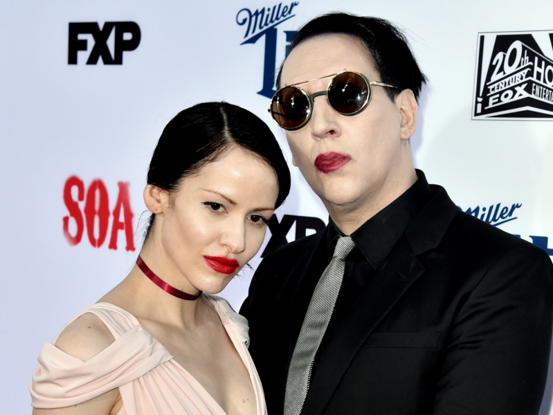LOS ANGELES, CA - SEPTEMBER 06: Actor/singer Marilyn Manson (R) and Lindsay Usich arrive at the season 7 premiere screening of FX's "Sons of Anarchy" at the Chinese Theatre on September 6, 2014 in Los Angeles, California.