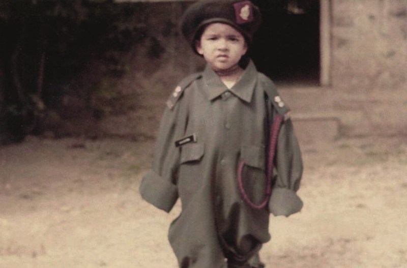 A photo of Priyanka Chopra as a young girl dressed in her father's Army uniform