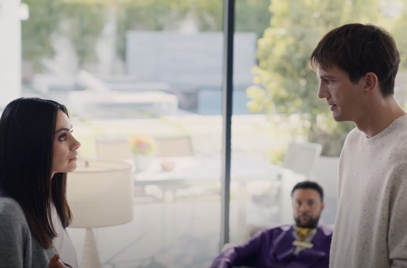 A screenshot of a Cheetos commercial starring Mila Kunis, Ashton Kutcher, and Shaggy