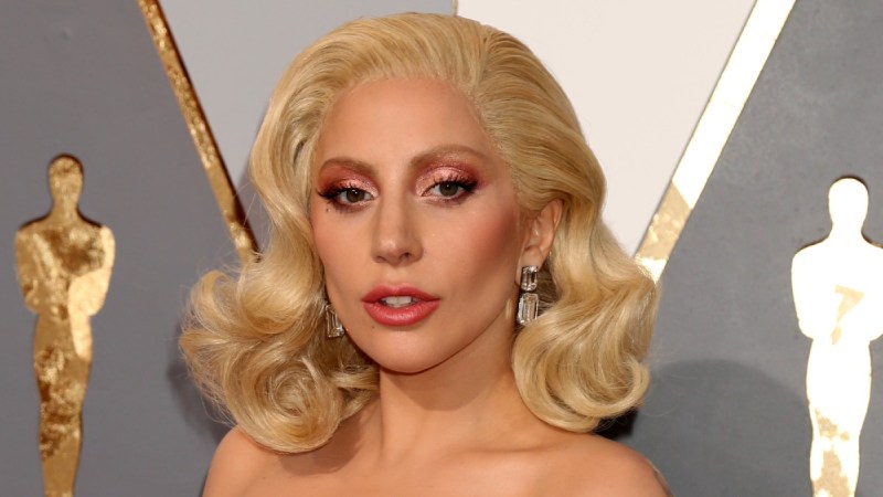 Lady Gaga wears a white strapless dress to the Oscars