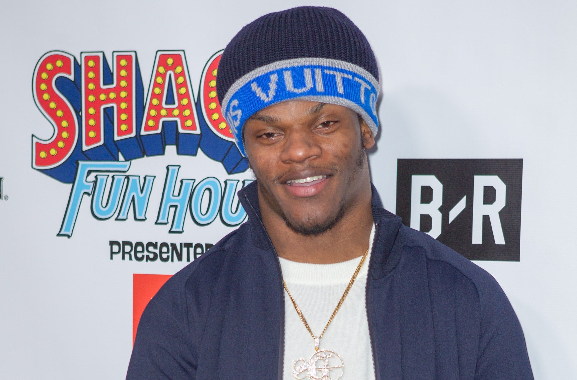 Lamar Jackson wearing a Louis Vuitton beanie and blue jacket at the 2019 Shaq Fun House