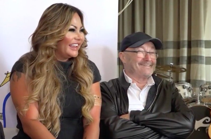 Screenshot of an aired interview with Phil Collins and Orianne Cevey sitting together