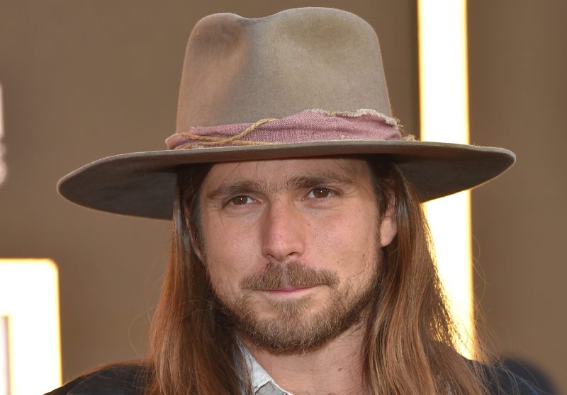 Lukas Nelson at the 'A Star Is Born' LA premiere in a tan hat.