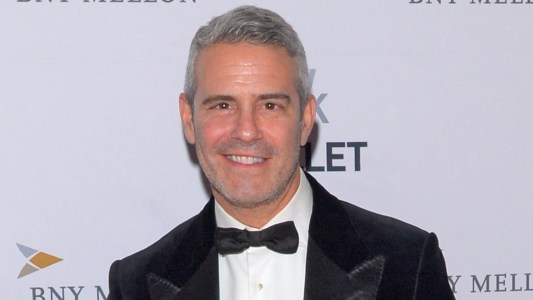 Andy Cohen smiling in a tuxedo