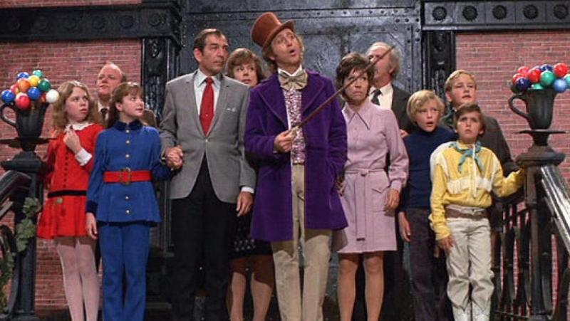 A screengrab of the most of the cast from 'Willy Wonka & the Chocolate Factory'