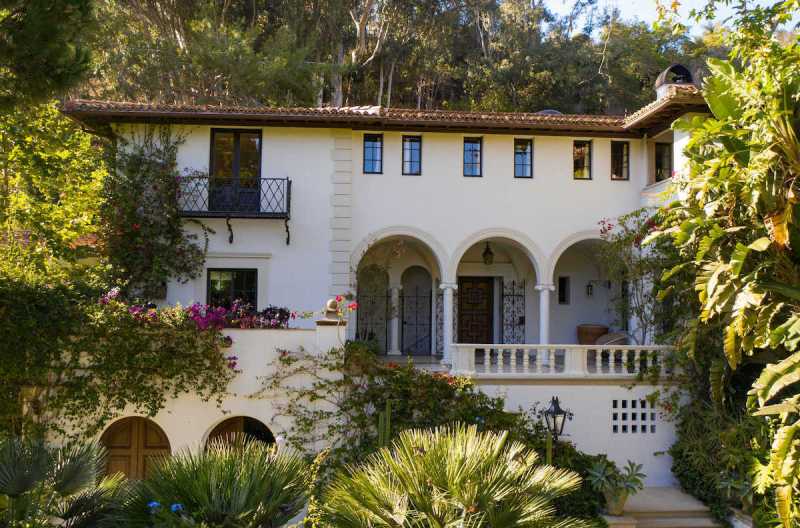 exterior shot of a villa surrounded by trees