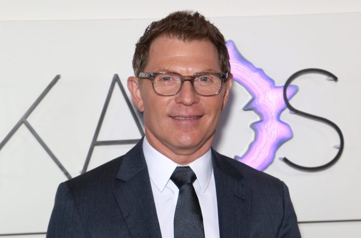 Bobby Flay wearing glasses and suit in 2019